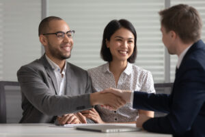 a male FMLA lawyer meeting with a young couple