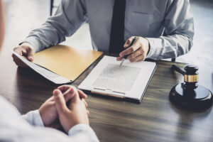 A wage theft and overtime pay dispute lawyer in Hartford reviewing legal options with a client.
