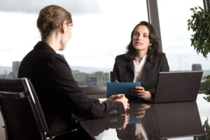 An employment and labor lawyer in Newton discussing legal options with their client.