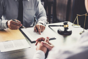 Client sits across desk from Providence employment discrimination lawyer